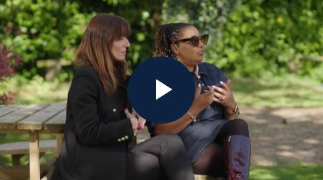 Davina McCall and Gayle Edwards seated and talking outdoors.